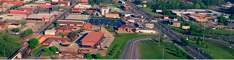 Aerial view of a small town with commercial buildings and roads