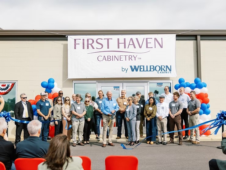 Group of people at a ribbon-cutting ceremony for First Haven Cabinetry