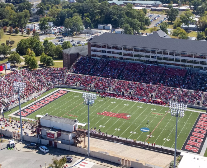 Aerial view of a packed stadium filled with fans in red