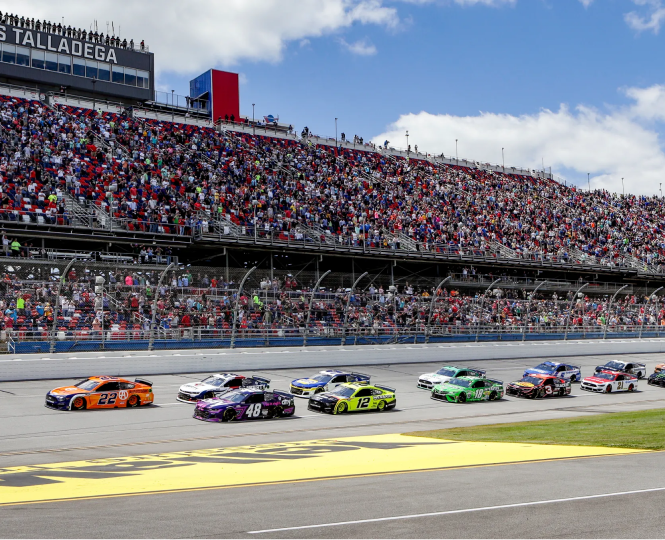 NASCAR race at Talladega with crowd in the grandstands